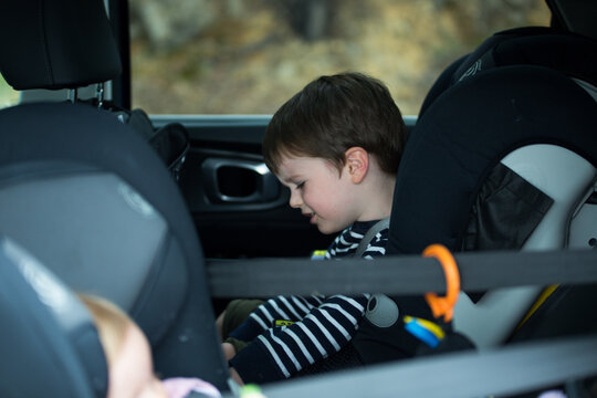 Upset Australian Boy In The Backseat Of A Car As His Parents Drive Him Home From The Park