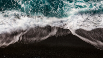 waves of the sea with a silk effect, shot by a drone on the coasts of the Ligurian sea