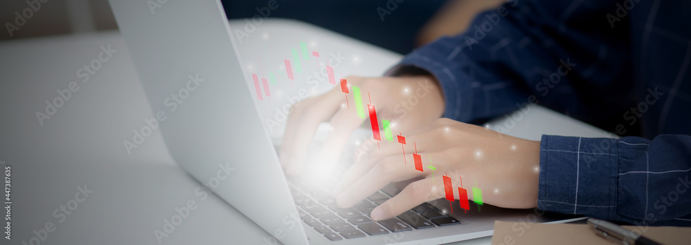 Aufkleber hands of businessman using laptop computer having graph of investment with risk stock and funds virt