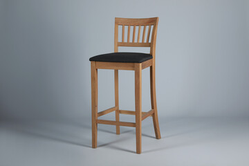 Stylish bar stool on light grey background. Interior element