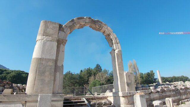 Marble arch with sun flare, ruins of ancient Ephesus, Turkey.