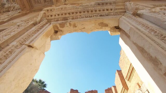 Panning down shot through the arch of an ancient architectural heritage site in Ephesus Turkey. 