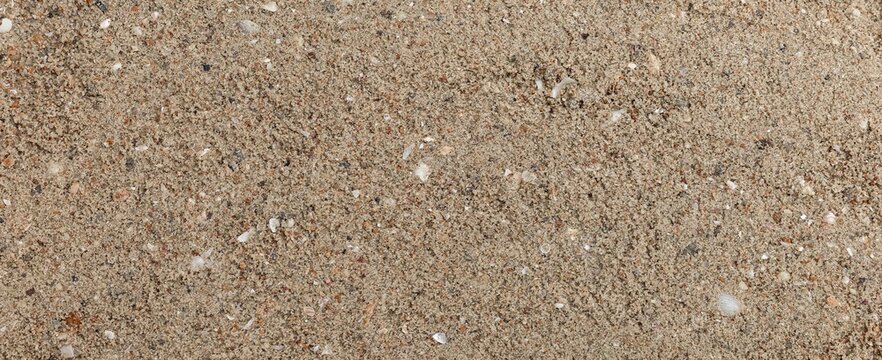 Panorama of Brown fine-grained sand at a clean beach texture and background seamless