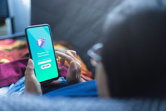 Register For vacination app on smartphone. - Powered by Adobe
