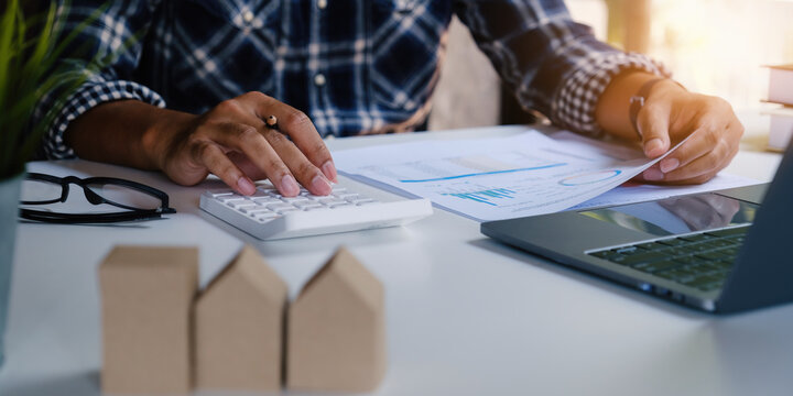 Business man waiting signing agreement contract for buying house or condominium. Bank manager concept.