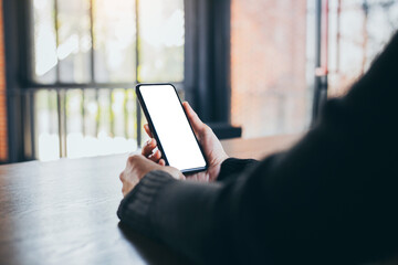 cell phone blank white screen mockup.woman hand holding texting using mobile on desk at office.background empty space for advertise.work people contact marketing business,technology