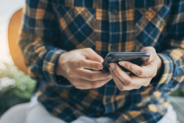 using cell phone hand holding mobile texting message contact us.chatting,search internet...