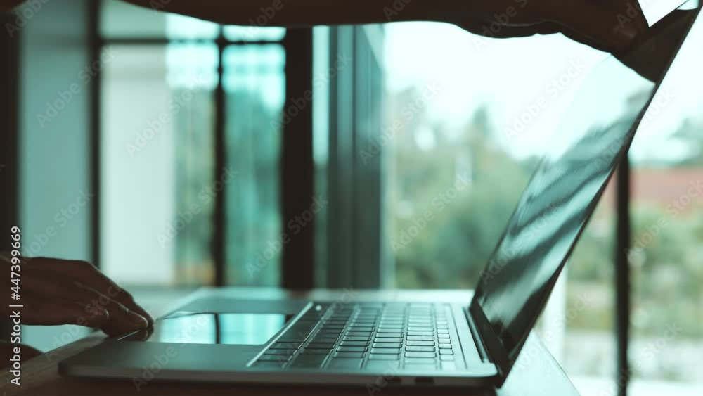 Poster man opening laptop for working. technology concept. close-up in 4k