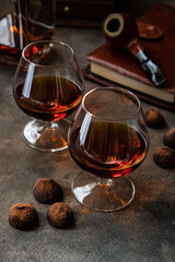 Cognac or whiskey in glasses on  dark background