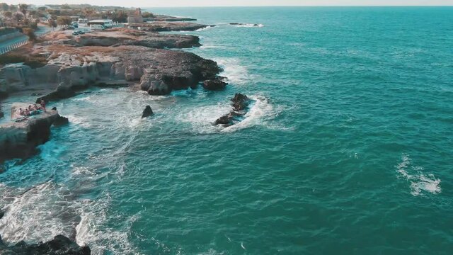 Breathtaking View Of Ancient Fortress Ruins And Coastal Cliffs At Capitolo Beach In Puglia Region, Italy. - Aerial Drone Shot