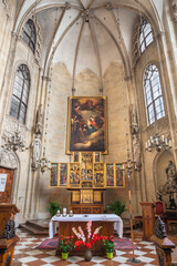 VIENNA, AUSTRIA - JULI 5, 2021: The presbytery of Teutonic Order church or Deutschordenkirche withe Flemish winged triptych, a polychromed altarpiece from year 1520.