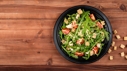 Rocket salad with tomato, crispy crouton, small pieces of herb roasted chicken and parmesan cheese...