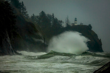 Thunderous waves over 40 feet tall crash into cliffs and rocks at Cape Disappointment, Washington when a King Tide. combine to create chaos and danger of unrivaled beauty.  
 - obrazy, fototapety, plakaty