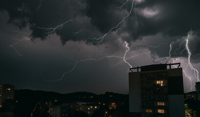 lightning in the night sky. heavy thunderstorms with striking