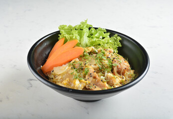 japanese oyakodon chicken rice bowl with salad in black bowl in white marble healthy poke bowl menu