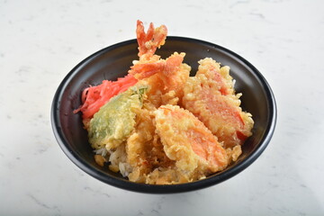 japanese deep fried tempura prawn and vegetables rice bowl in black bowl in white marble healthy poke bowl menu