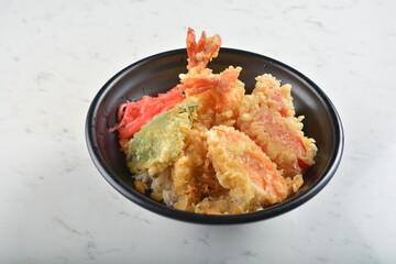 japanese deep fried tempura prawn and vegetables rice bowl in black bowl in white marble healthy poke bowl menu