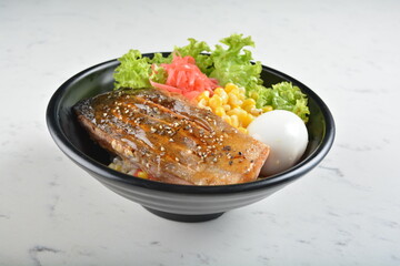japanese bbq grill teriyaki salmon seafood with boiled egg, corn, red ginger and rice bowl with onsen egg in black bowl in white marble healthy poke bowl menu