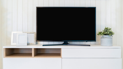 TV with Blank Screen Mock Up. Television on the cabinet in modern living room.
