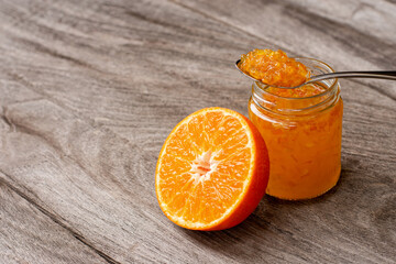 Obraz na płótnie Canvas orange jam on table