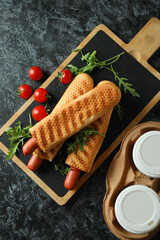 Concept of tasty food with french hot dog