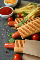 Concept of tasty food with french hot dog