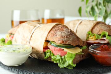 Concept of tasty eating with ciabatta sandwiches, close up