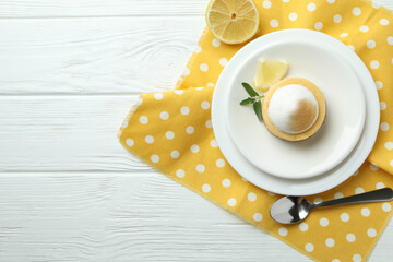 Fototapeta na wymiar Concept of tasty breakfast with lemon cupcake on white wooden table