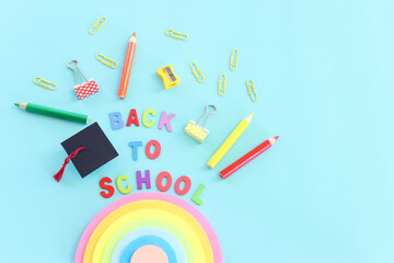 education and back to school concept. stationery over blue background. top view, flat lay