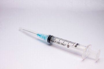 syringe with a needle isolated on white background