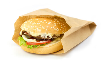 Fresh, delicious burgers packed in paper bags.  isolated on white background
