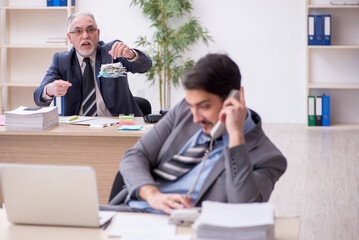 Two male bookkeepers in budget planning concept in the office