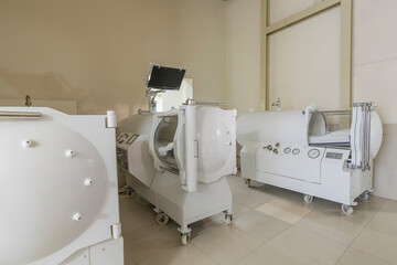 A clinic with hyperbaric treatment machines.