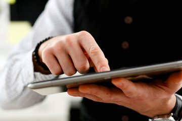 Male arm point finger using tablet pc display