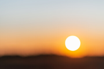 Blurred sunset landscape.Summer holiday concept. blurry beautiful sunlight and golden sunset background.