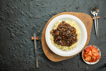 Jajangmyeon , Noodles with Black Bean Sauce, Korean-Chinese noodle dish with kimchi.