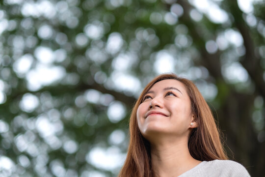 Portrait image of a beautiful young asian woman in the park