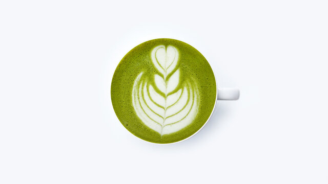 A cup of green tea matcha latte isolated on white background                                                      