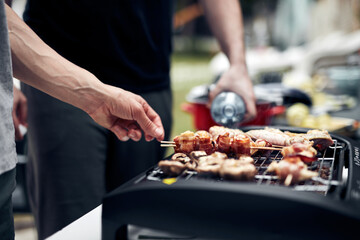 Preparing barbeque on a electrical modern grill outdoors.