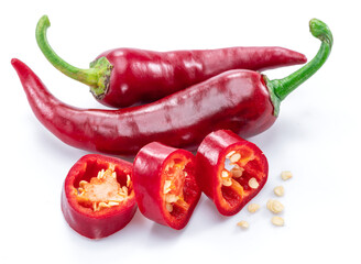 Fresh red chilli pepper and cross sections of chilli pepper with seeds isolated on white background.