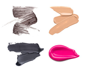 Set of cosmetic products. Smear of pink lipstick, brown smear of mascara and black eyeliner, foundation smears of makeup isolated on white background.
