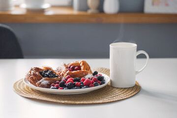 cup of tea  and dessert with berries on kitchen