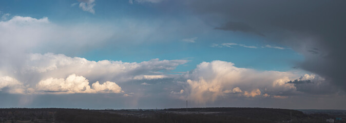 Beautiful sky with dark clouds. A panoramic composition in high resolution.