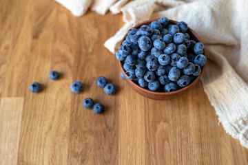 Blueberries on wooden table, close up