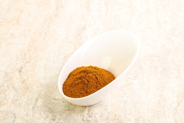 Dry Paprika powder in the bowl