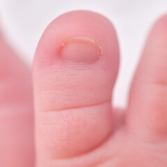 Toes on the foot of a newborn baby, close-up. Macro photo of a healthy toe of a child