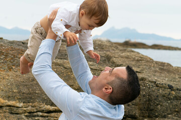 father and child on beach