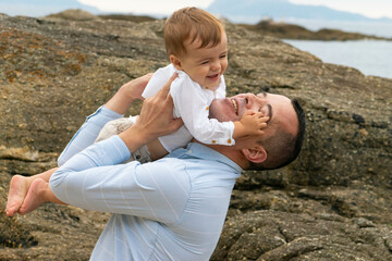father and child on beach