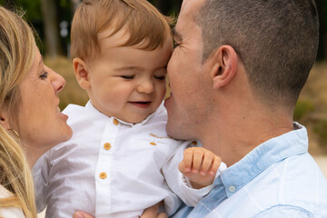 parent kissing their child