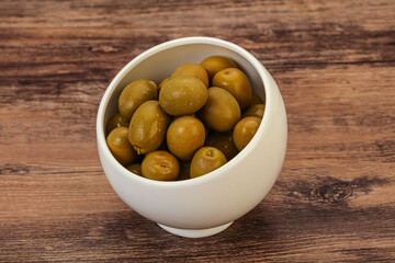 Green pickled olives in the bowl